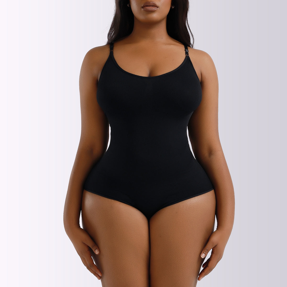 Black seamless cheeky shaping bodysuit, front view on model