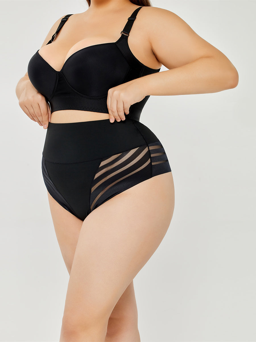 Black high-waist shaping briefs on model