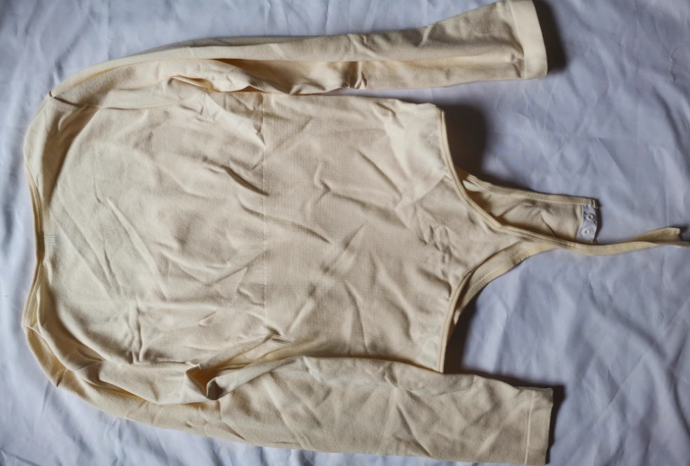 Nude long-sleeve bodysuit, flat view